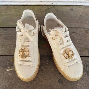 Louis Vuitton Luxurious Sneakers with Gold Accents